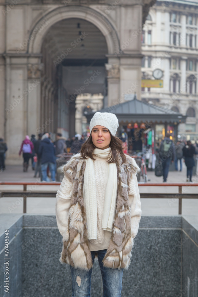 Beautiful young woman posing in the city streets Beautiful young woman posing in the city streets