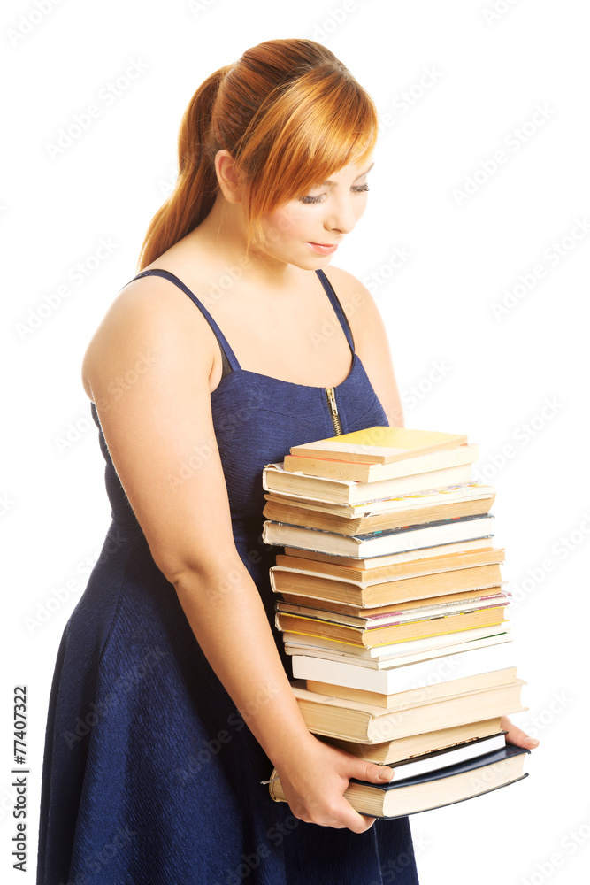 Overweight woman holding books Overweight woman holding books