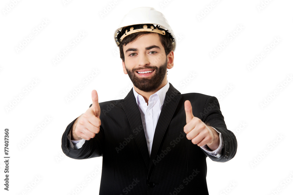 Engineer in protective helmet with thumbs up. Engineer in protective helmet with thumbs up.