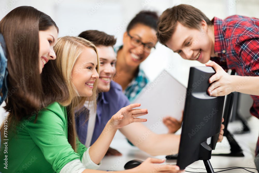 students looking at computer monitor at school students looking at computer monitor at school