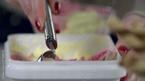 Detail of scooping the ice cream from the package photo