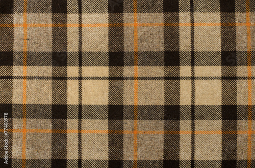 Scottish tartan pattern. Brown, orange plaid print as background