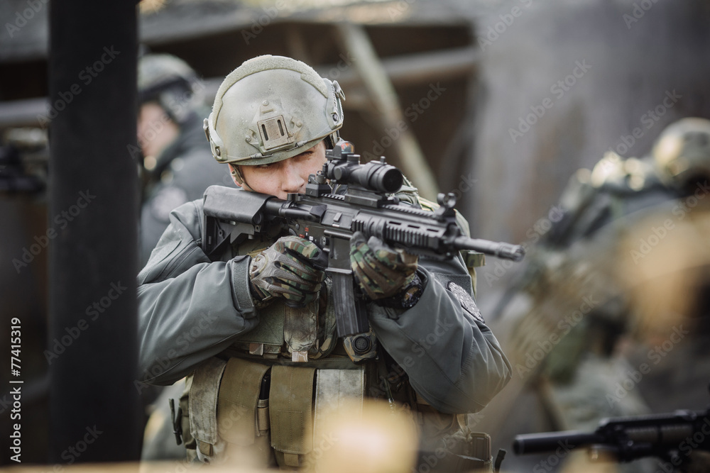 Fototapeta premium military soldier shooting an assault rifle