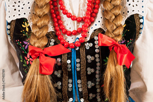 A young woman wearing a traditional Polish folk costume photo
