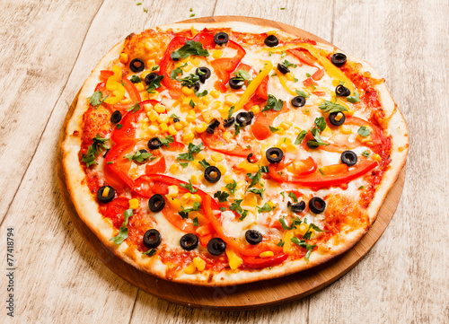 pizza on the wood background