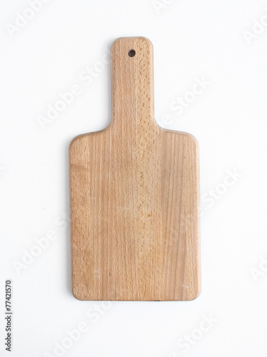 Rustic wooden cutting board on a white background