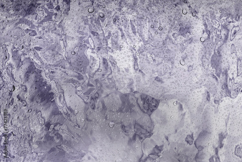 Water drops on glass and defocus nature flowers chrome backgroun