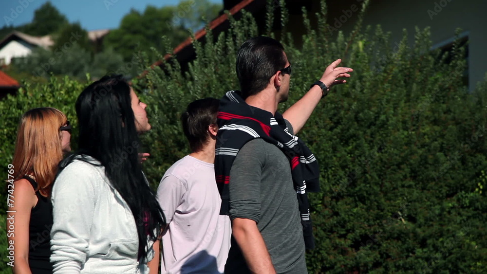HD1080p: Two young couples looking at the house while walking HD1080p: Two young couples looking at the house while walking