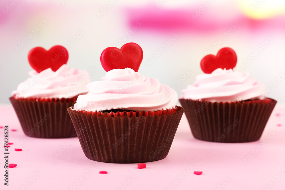 Delicious cupcakes for Valentine Day on bright background