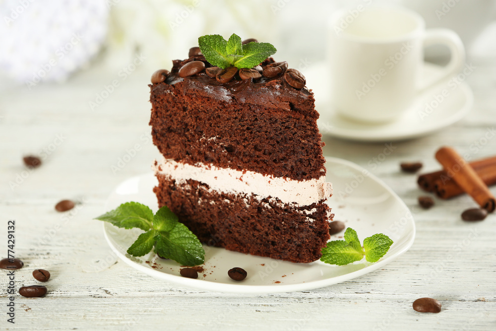 Delicious chocolate cake on table on light background Delicious chocolate cake on table on light background