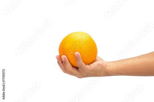 Hand holding orange