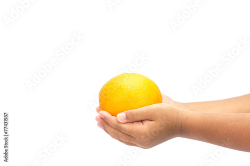Hand holding orange