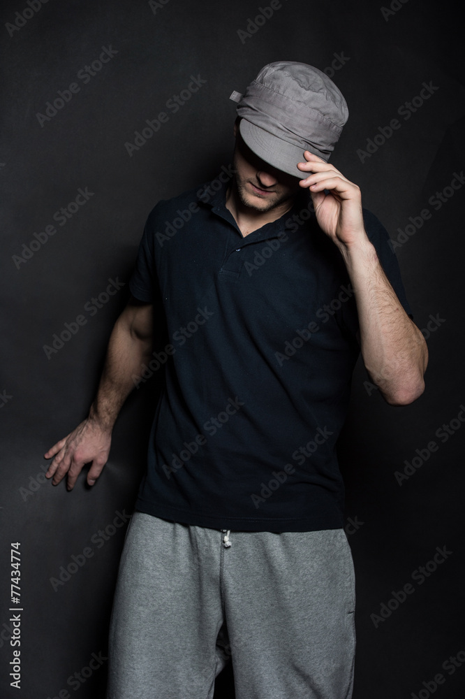 young dancer isolated on black background in studio. young dancer isolated on black background in studio.