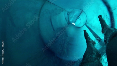 Personal view of man going down the waterslide