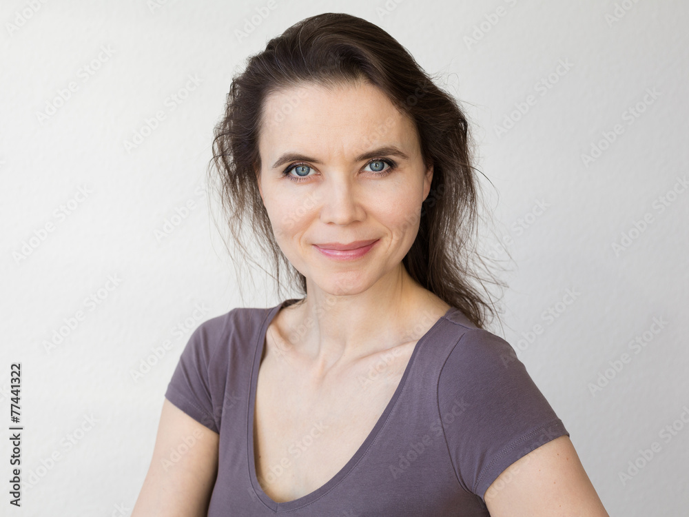 Woman with attractive smile looking into camera Woman with attractive smile looking into camera