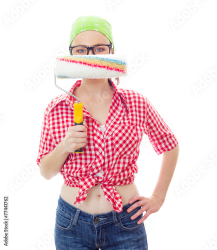 Worker female holding paint roller afore her face photo