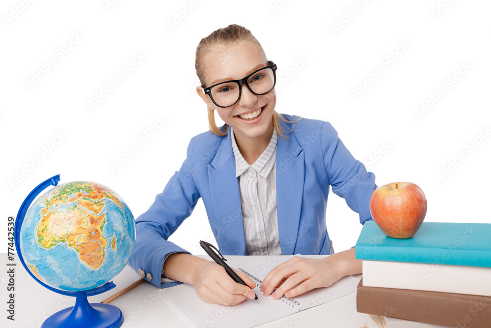 Smiling student girl in eyeglasses reading books