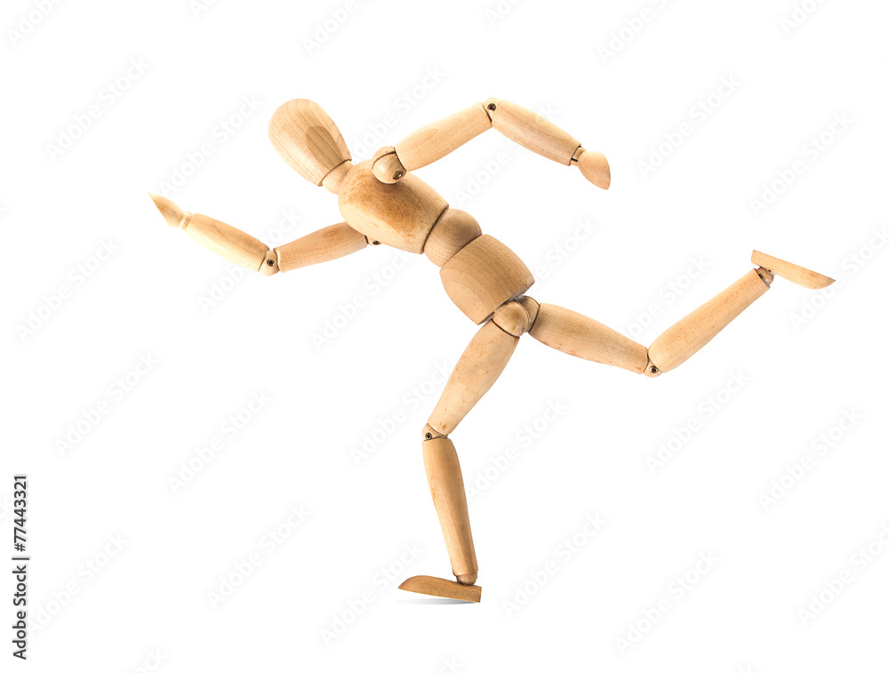 Wooden figure on running pose isolated on white Wooden figure on running pose isolated on white
