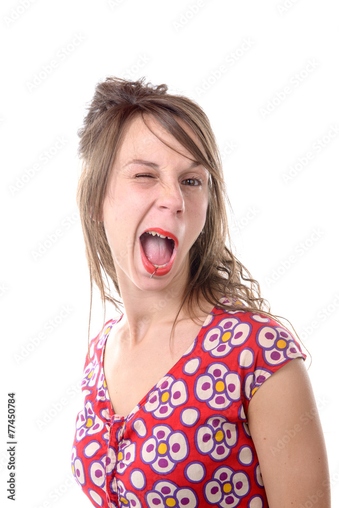 a young woman of twenty makes a grimace a young woman of twenty makes a grimace