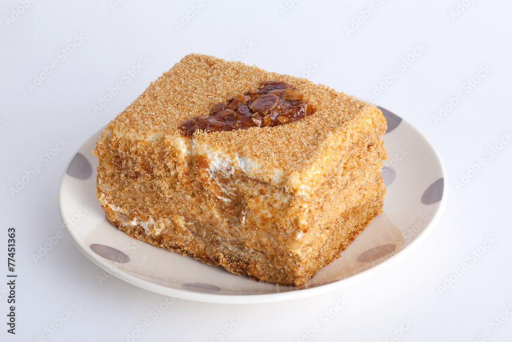 honey cake with caramel pattern on a plate honey cake with caramel pattern on a plate