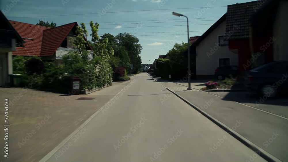 Driving with car through empty street
