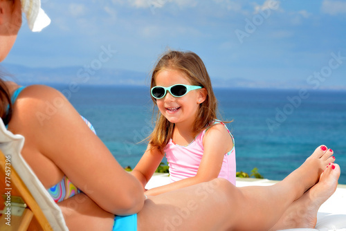 Toddler girl on sunbed