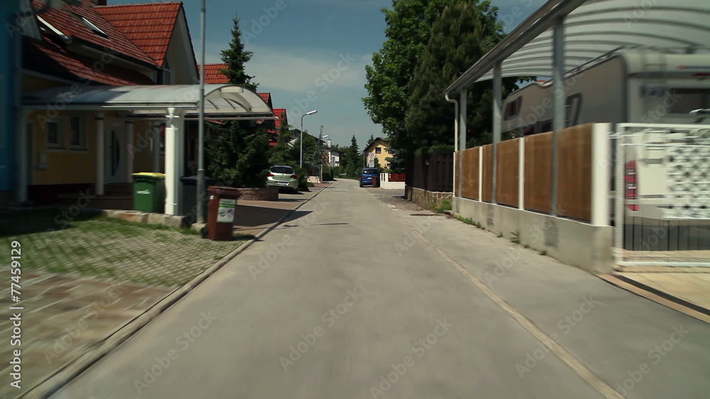 Driving with car through empty street