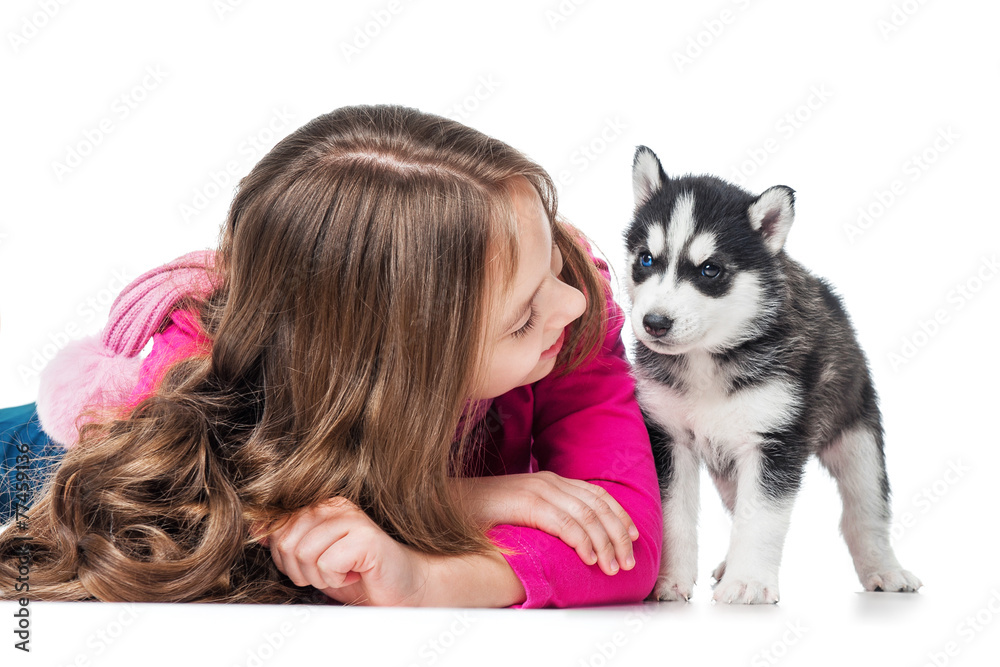 Girl with a puppy husky, isolated on white