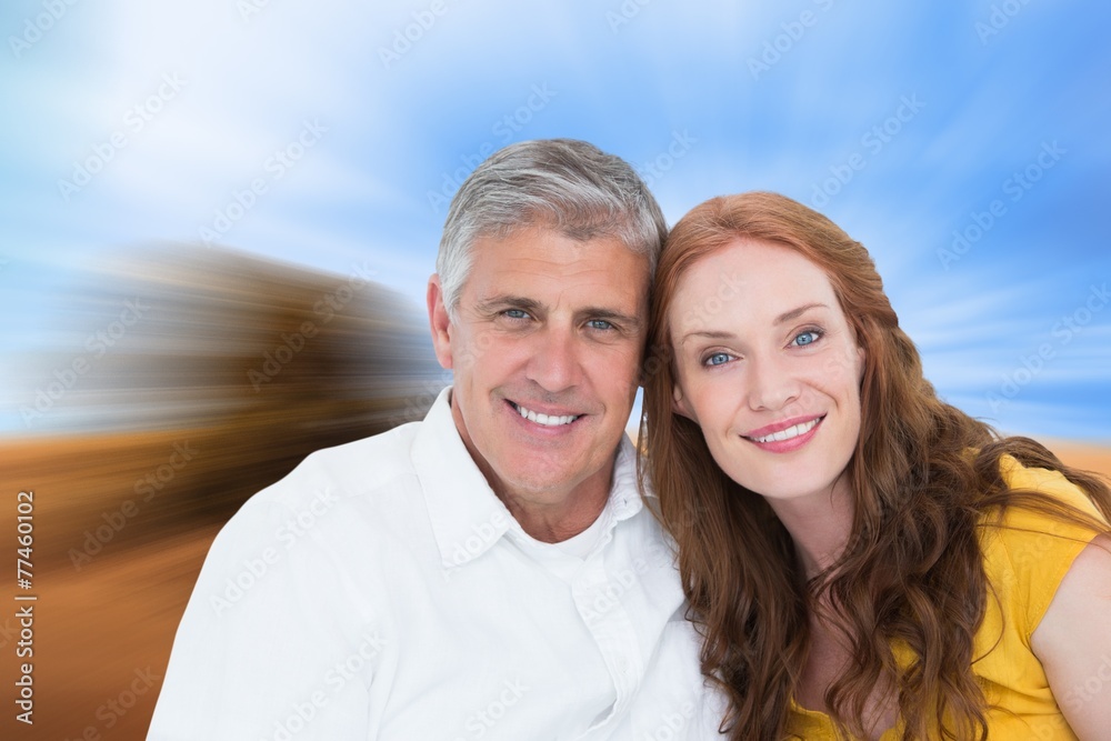 Composite image of casual couple smiling at camera Composite image of casual couple smiling at camera