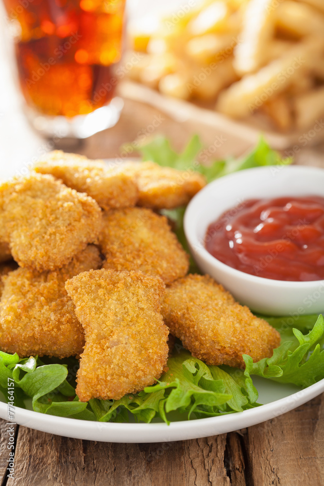 fast food chicken nuggets with ketchup, french fries, cola fast food chicken nuggets with ketchup, french fries, cola