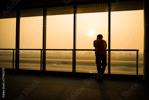 Silhouette of man waiting for the flight