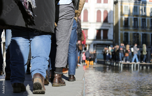 People walking on the catwalk in Venice