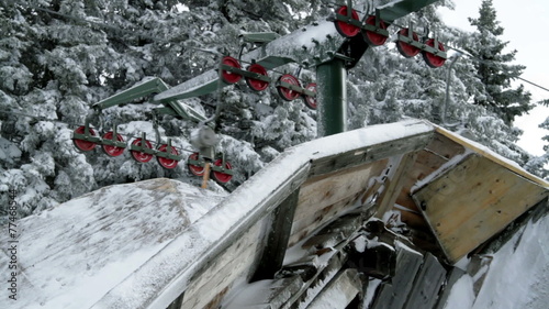 a cableway in the idyllic winter time soroundings photo