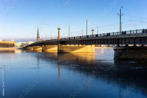 Bridge over the frozen river Daugava in Riga in winter