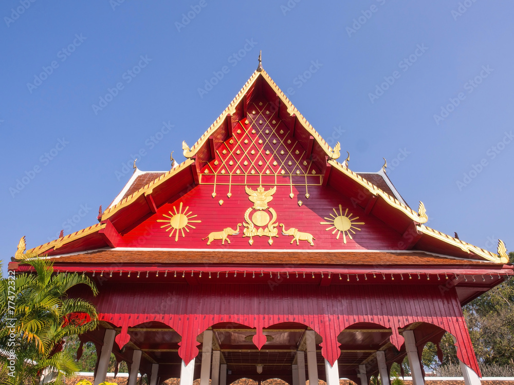 Northern Thai art roof in Thai temple under blue sky