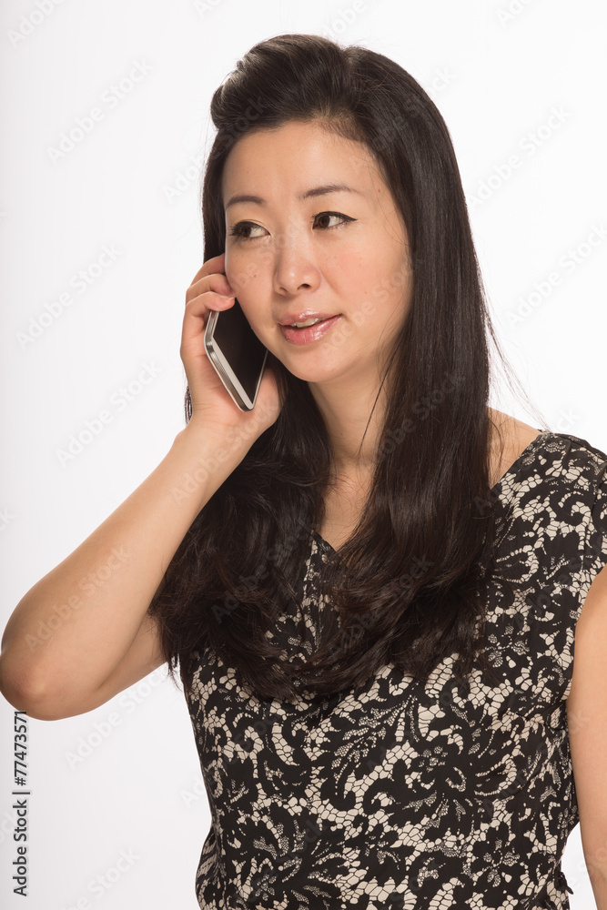 Young Asian woman texting on cell phone smart phone Young Asian woman texting on cell phone smart phone
