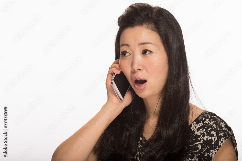 Young Asian woman texting on cell phone smart phone Young Asian woman texting on cell phone smart phone