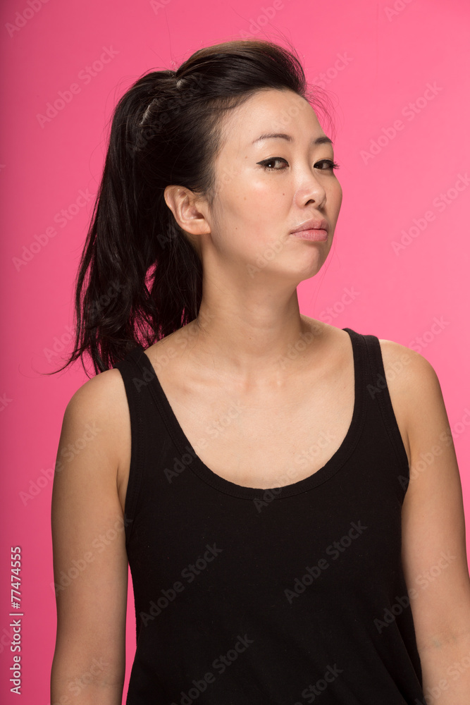 Young Asian woman serious face portrait Young Asian woman serious face portrait