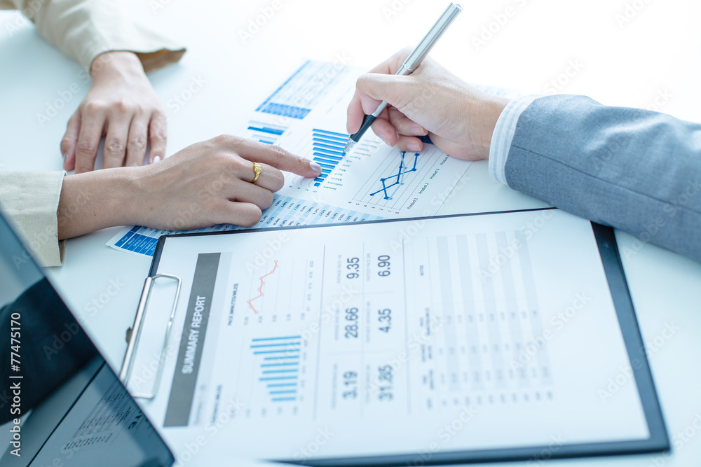 Business people discussing the charts and graphs showing the res Business people discussing the charts and graphs showing the res