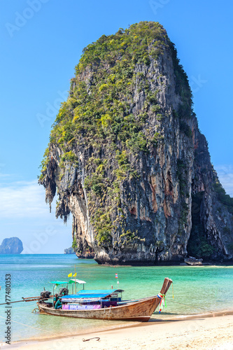 Wooden boat on tropical beach Railay in Thailand.