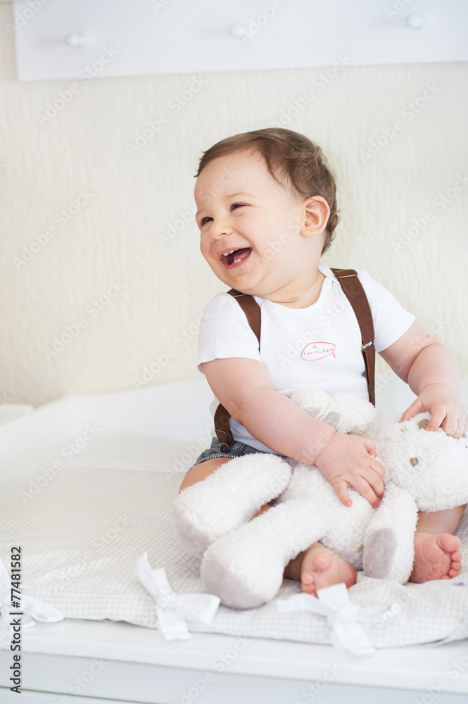 Fototapeta premium Happy little child, baby boy laughing and playing