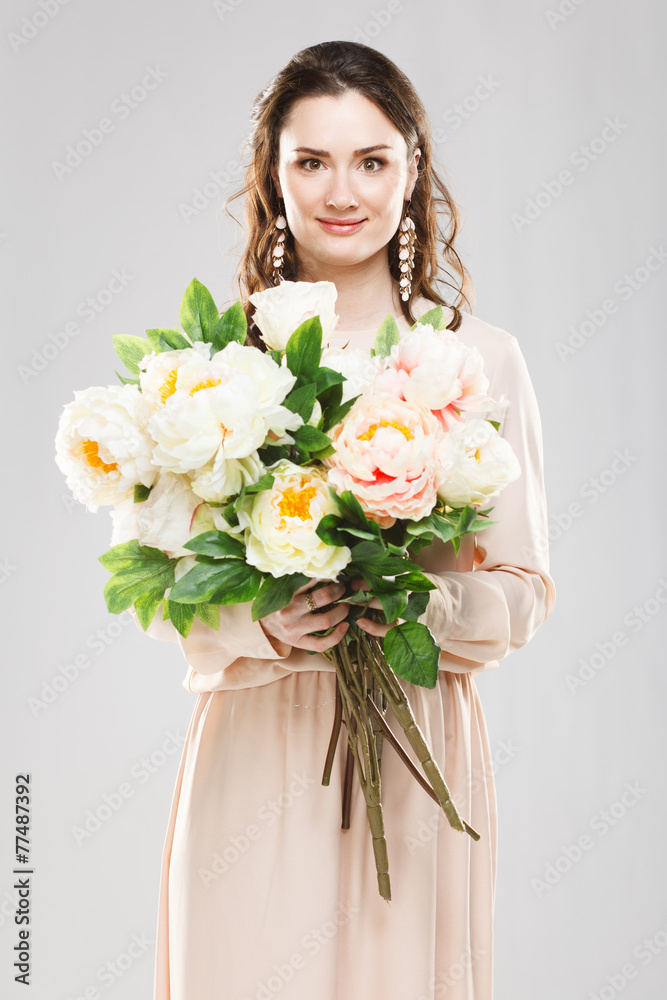 Young beautiful woman with a bouquet of flowers Young beautiful woman with a bouquet of flowers