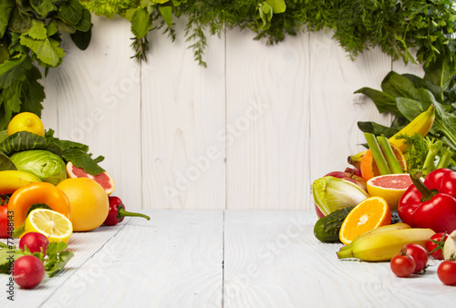 Fototapeta Naklejka Na Ścianę i Meble -  Fruit and vegetable borders on white wooden old table