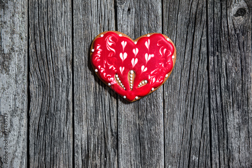 Heart cookie on wood background