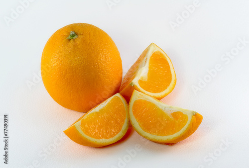 Orange and three orange slices.