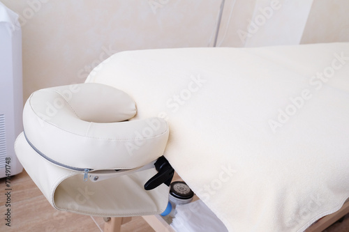white leather massage table detail photo