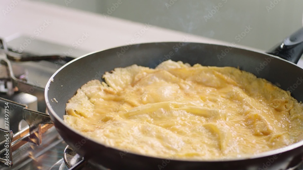 Scrambled eggs preparation in slow motion Scrambled eggs preparation in slow motion