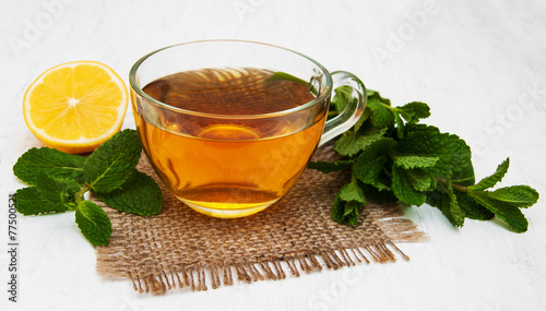 Cup of tea with lemon and mint