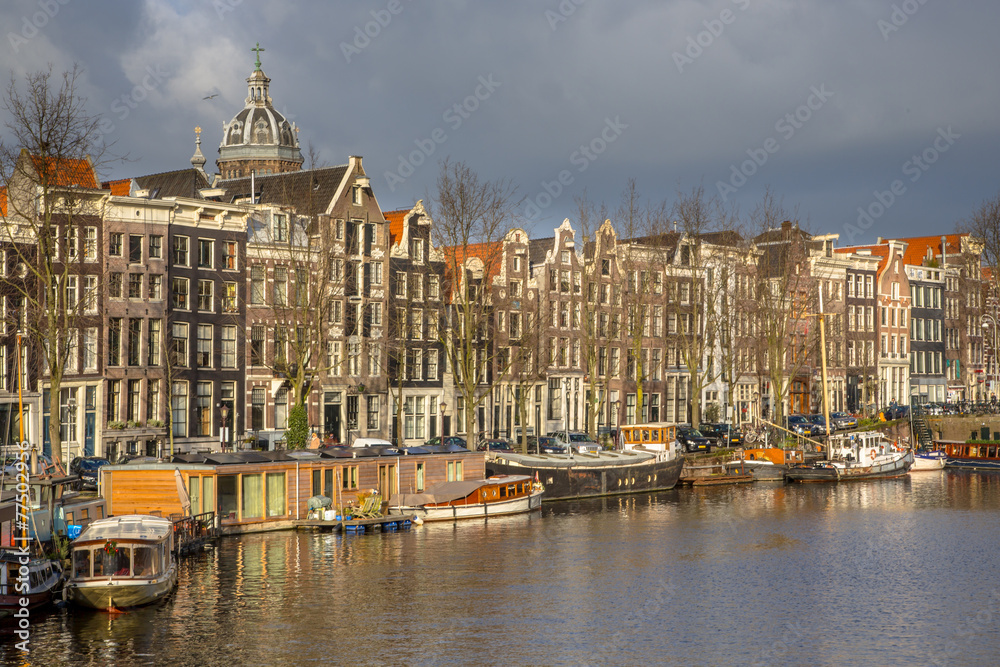 Canal houses and house boats in Amsterdam