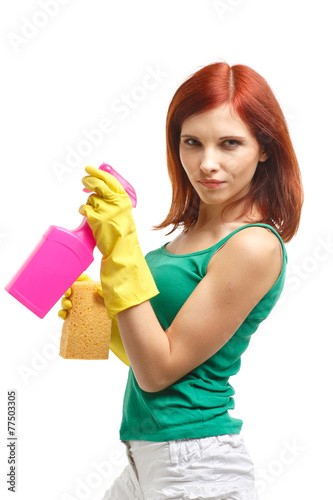 Young woman with spray bottle and sponge.